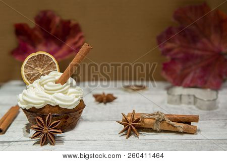 Pumpkin Spice Muffin Frosted With Mascarpone Chesee And Cream, Whipped 
Icing, Decorated With Cinnam