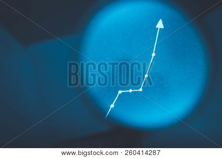 Exponential Diagram. Growth Statistics Progress Concept. Arrow Pointing Up On Blurred Blue Backgroun