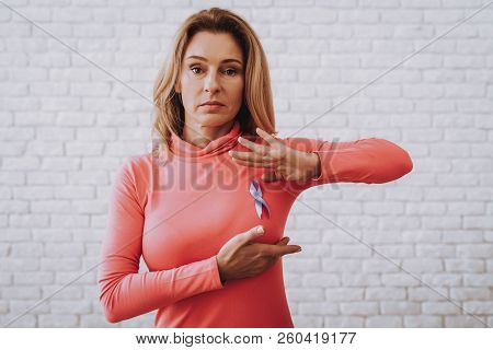 Pink Blouse With Ribbon. Woman Support People With Cancer. Studio With Woman. Health And Help People