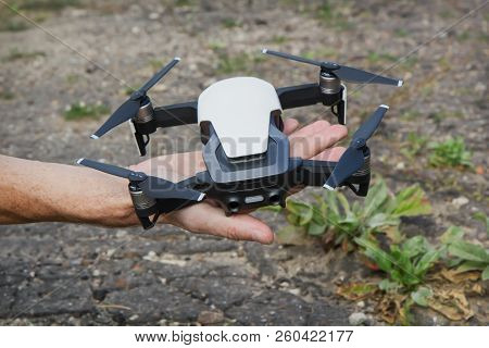 Unmanned Aircraft With Four Rotors In Hand Man