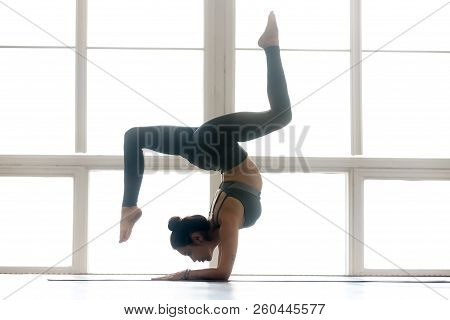 Young Sporty Attractive Woman Practicing Yoga, Doing Pincha Mayu