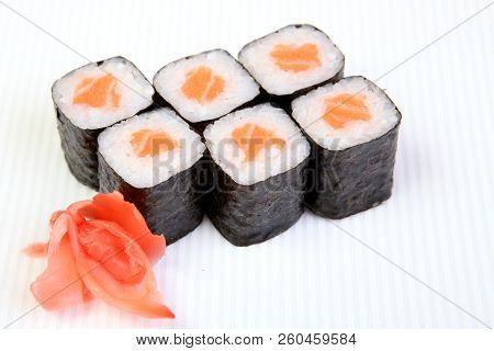 Rolls Of Syak Maki. Japanese Food On A Beautiful Dish. Dietary Food. An Exquisite Japanese Dish. Fre