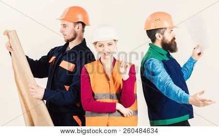 Men And Woman In Helmets Carefree With Hammer And Project