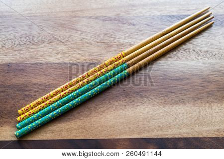 Natural Bamboo Chopsticks On Wooden Table Background.