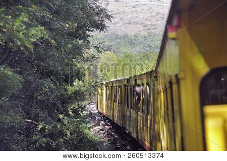 Latour De Carol - September 4, 2018: The Small Yellow Train Of The Pyrenees Crossing A Beautiful Mou