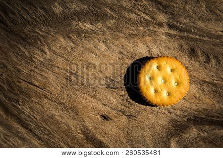 Crackers Are Placed On A Wooden Floor.