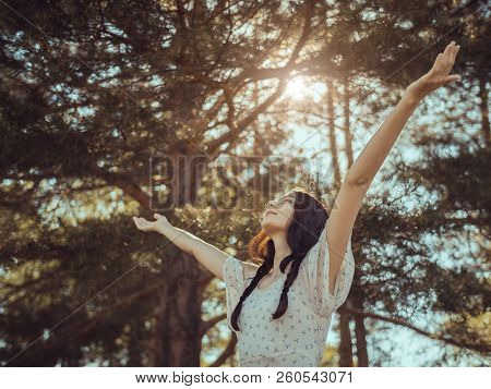 Free Happy Woman In Forest Enjoying Nature. Natural Beauty Girl Outdoor In Freedom Enjoyment Concept