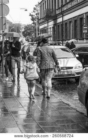 Vilnius, Lithuania - May 17, 2014: Suddenly Heavy Rain Started Almost All People Opened Their Umbrel