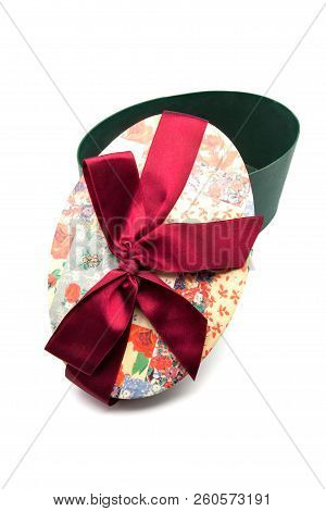Oval Gift Box With Red Bond On White Background
