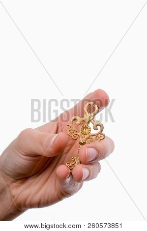 Hand Holding An Isolated Paper House With A White Background
