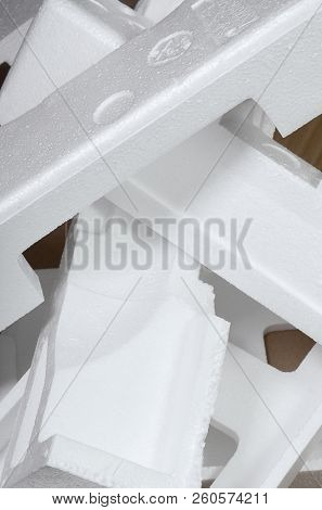 Background Image With Beige Cardboard Paper And Styrofoam Boxes Disgarded As Rubbish. The Concept Of