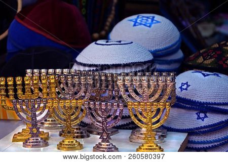 Candlesticks Of The Menorah Are Gold And Silver. Knitted Multi Colored Kipa Are Sold In The Market I