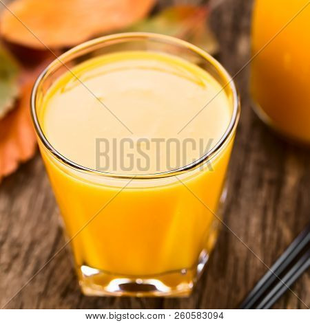 Fresh Homemade Pumpkin Smoothie In Glass With Drinking Straws On The Side, Photographed On Wood (sel