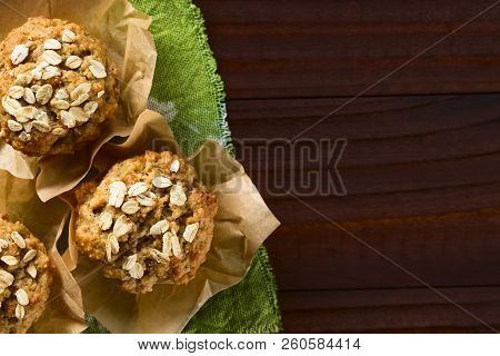 Fresh Homemade Apple And Oatmeal Muffins With Oats On Top, Photographed Overhead With Copy Space On 