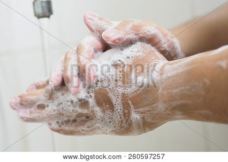 Close Up Of Medical Staff Washing Hands. Hand Hygiene.