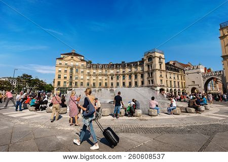 Munich, Germany - Sept 6, 2018: Tourists And Locals Visit The Karlsplatz Or Stachus And The Karlstor