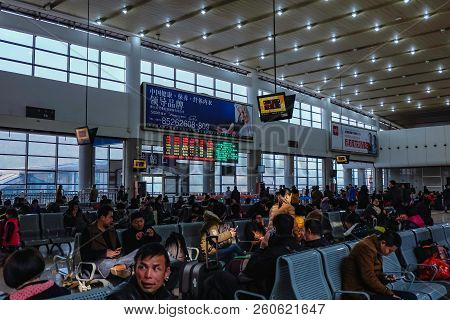 Yiwu/china - January 24 2015: Chinese People Wait For The Rocket Train To Go To Another City In Yiwu