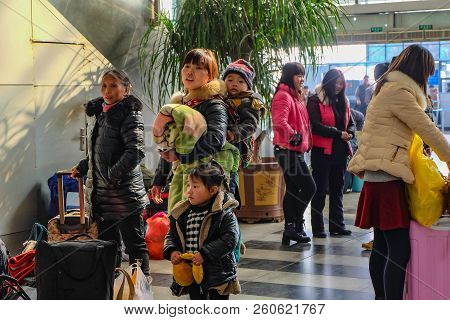 Yiwu/china - January 24 2015: Chinese People Wait For The Rocket Train To Go To Another City In Yiwu