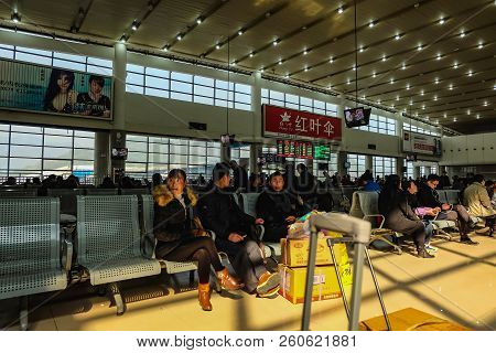 Yiwu/china - January 24 2015: Chinese People Wait For The Rocket Train To Go To Another City In Yiwu