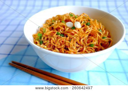 Instant Noodle In White Ceramic Bowl On Napery