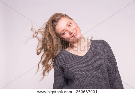 Portrait Of Beautiful Young European Blonde Woman With Blond Flatterig Hair.