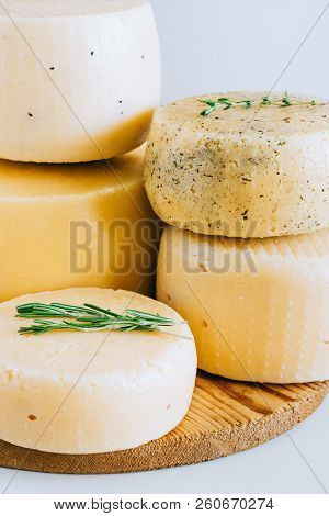 Assorted Cachotta Cheese Head With Black Cumin, Fenugreek And Herbs On White Background