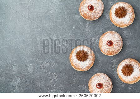 Jewish Holiday Hanukkah Sufganiyot On Blackboard Background. View From Above