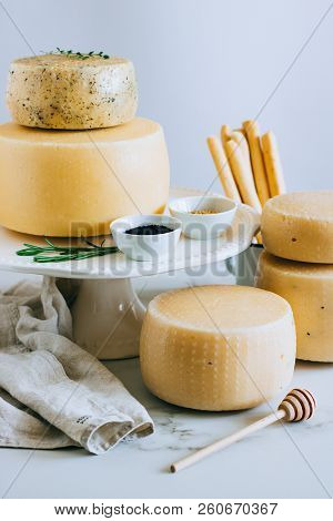 Assorted Cachotta Cheese Head With Black Cumin, Fenugreek And Herbs In Cake Stand With Bread Sticks 