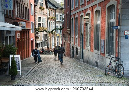AACHEN, GERMANY - November 19, 2017: Tourists on foot Street in Aachen, Germany. Aachen was a residence of Charlemagne, and later the coronation place for German kings, Aachen, Germany