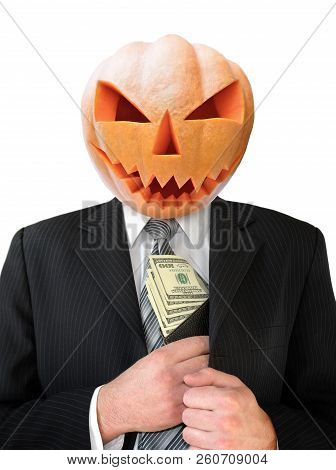 Portrait Of Jack Lantern  From Pumpkin In Black Business Suit. Jack Lantern Keeps Money In His Hands