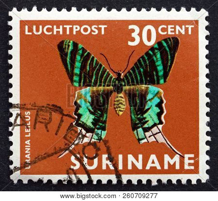 Suriname - Circa 1972: A Stamp Printed In Suriname Shows Green-banded Urania, Urania Leilus, Butterf