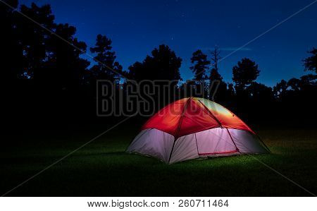 Tent Lighted At Night In North Carolina With Stars Above