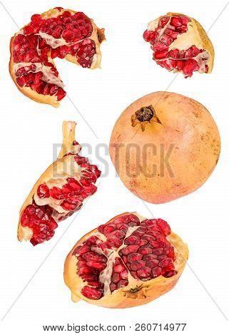 Creative Fruit Concept. Pomegranates Flying In The Air Isolated On White With Clipping Path. Levity 
