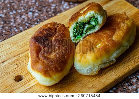Fresh Fried Small Handmade Patties With Green Onions And Egg On A Cutting Wooden Board