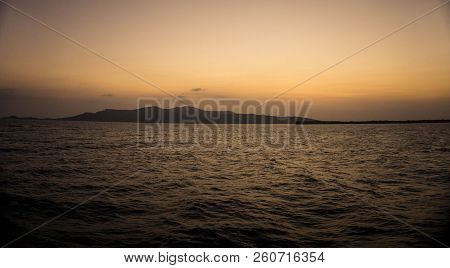 Sunrise Sky On The Island See From Far Away Sea In Karimun Jawa Indonesia With Golden Color And Sea 