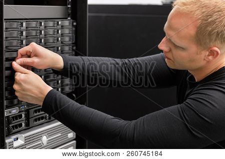 Male Technical Consultant Adjusting Hard Drives In San At Datace