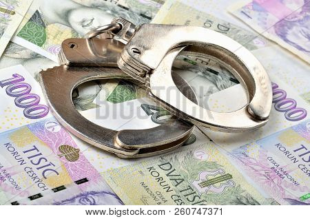 Corruption - Police Handcuffs On Czech Banknotes, Czech Crown Money Czk - The Concept Of Finance And