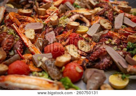 Gourmet Seafood Valencia Paella With Fresh Langoustine, Clams, Mussels And Squid On Savory Saffron R
