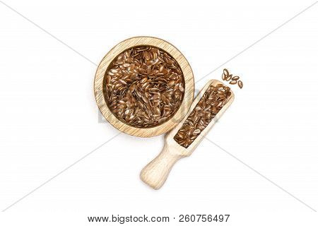 Lot Of Whole Fresh Brown Flaxseeds In A Scoop With Wooden Bowl Flatlay Isolated On White Background