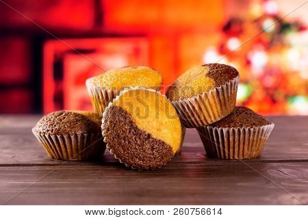 Group Of Five Whole Fresh Baked Marble Muffin With Christmas Tree In Red Background
