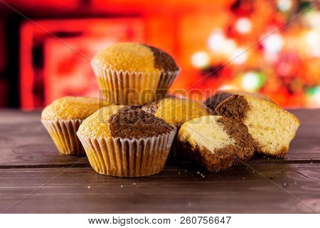 Group Of Four Whole Two Halves Of Fresh Baked Marble Muffin With Christmas Tree In Red Background