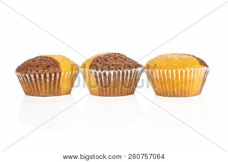 Group Of Three Whole Fresh Baked Marble Muffin In Row Isolated On White Background