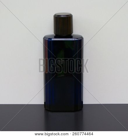Eau De Toilette, Large Perfume Bottle In Front Of White Background