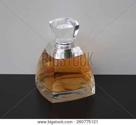 Fragrance For Ladies, Large Perfume Bottle In Front Of A White Background