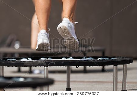 Fitness Women Jumping On Small Trampolines,exercise On Rebounder