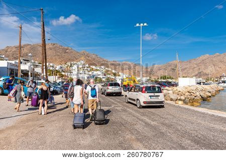 Serifos, Greece - September 8, 2018: Tourists Walking With Bags On Street In Serifos Island.