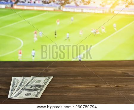 Money Dollars On The Background Of The Tv On Which Show Gaelic Football, Sports Betting, Dollars, Ga