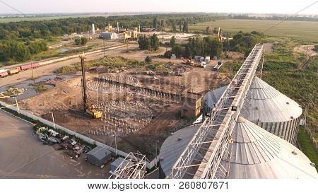 Construction Of Grain Factory At Rural Location. Storage Bin Tanks Outdoor.