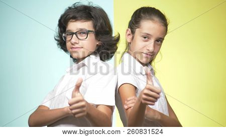 Portraits Of Children In School Uniform On A Colored Background. Funny Children. Sister And Brother.