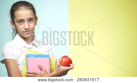 Portraits Of A Teenage Girl In School Uniform On A Colored Background. Funny Girl. Concept Of Learni